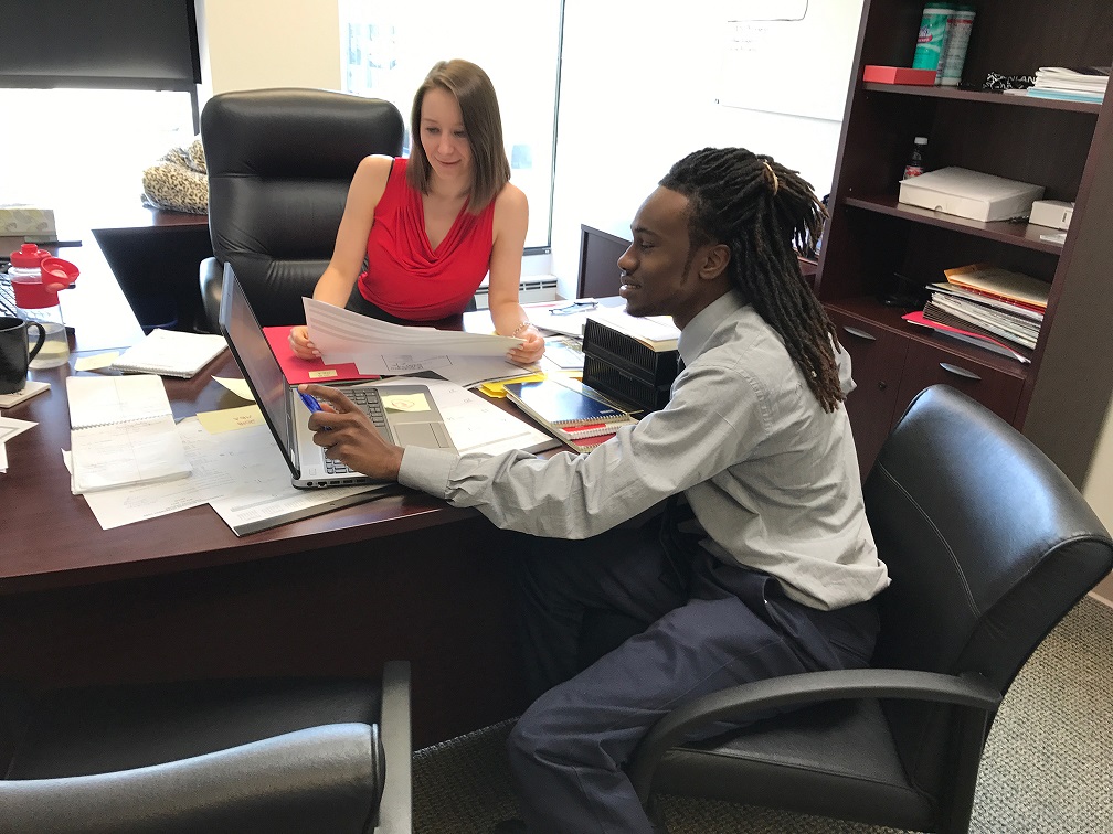 Anna Kuta helps Chicago All-Stars Project‘s Eddie Gardner complete a project during his summer internship at Inland Mortgage Capital. For more information on Chicago All Stars Project, Inc., please visit: https://allstars.org/locations/chicago/